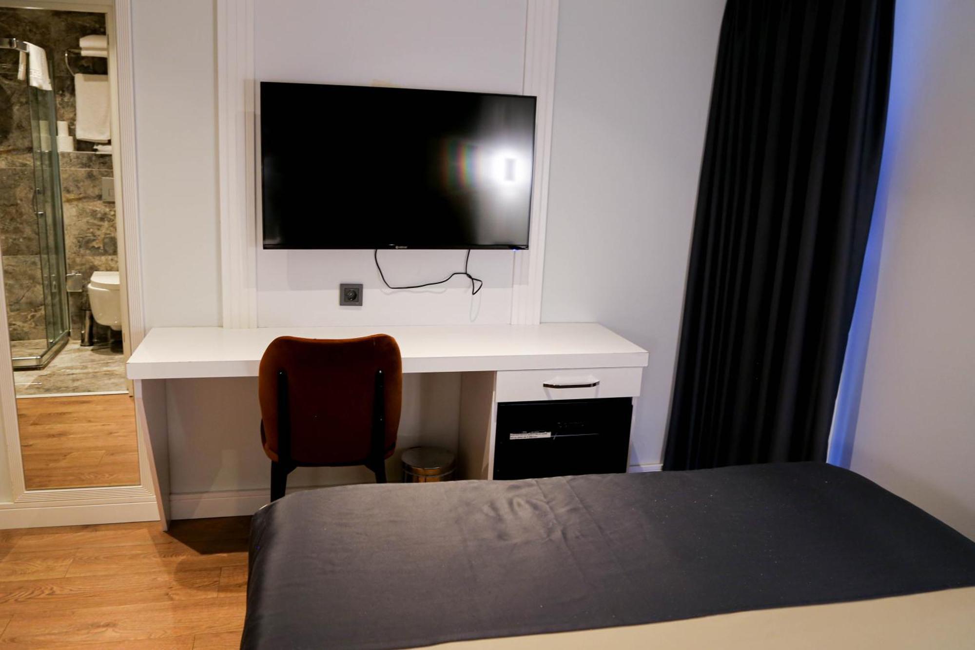 Axu Airport Hotel Arnavutkoy Exterior photo A television in a hotel room